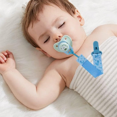 Attache tétine en silicone bleu apaisante bébé endormi paisiblement