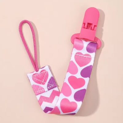 Attache tetine en silicone design coeur rose