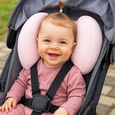 bébé souriant poussette noire Cale tete bebe Rose