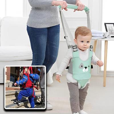 Harnais-pour-bebe-vert-bretelles-grises-pantalon-brun