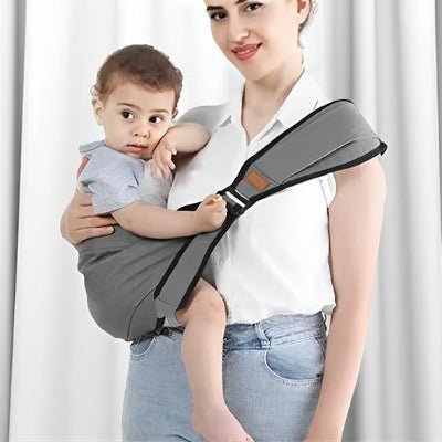 porte bebe frontal ergonomique gris enfant installé confortablement 