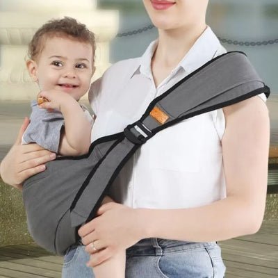 porte bebe frontal ergonomique gris pale bébé souriant