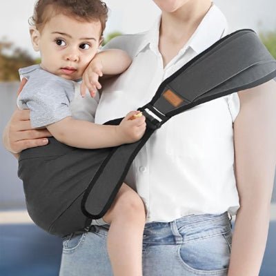 porte bebe frontal ergonomique gris foncé ajustable enveloppant bébé curieux
