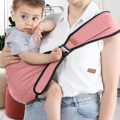 porte bebe frontal ergonomique rose enfant confortablement installé