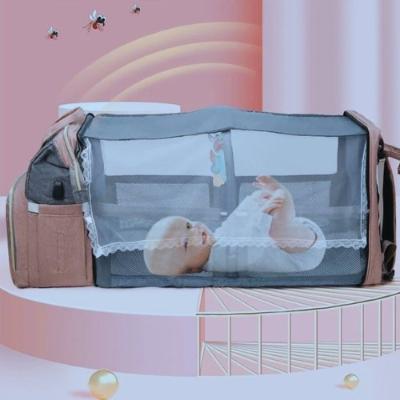 Sac-à-dos-à-langer-bebe-sourire-moustiquaire