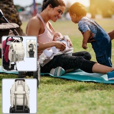 sac-a-langer-a-dos-gris-attache-poussette-maman-nouveau-né-et-bébé-dans-un-parc-valise-de-voyage