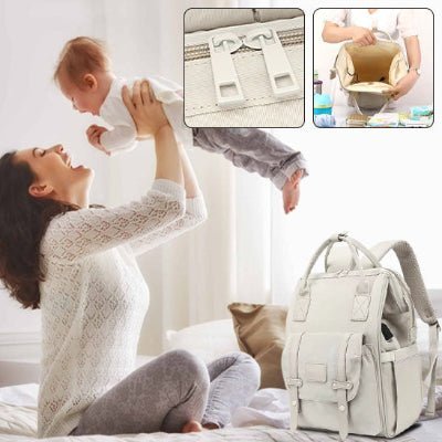 sac-à-langer-à-dos-gris-rangement-fermeture-glissière-bébé-dans-les-bras-de-maman