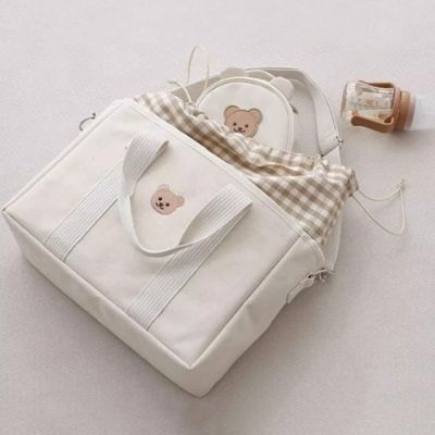 sac-a-langer-beige-tissu-damier-motif-tete-ours-brun